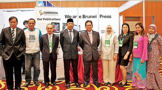 Pehin Dato Seri Setia Awg Hj Suyoi stops by the Brunei Press booth. – PHOTOS: DANIAL NORJIDI